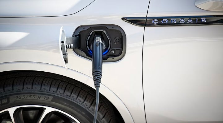 An electric charger is shown plugged into the charging port of a Lincoln Corsair® Grand Touring
model. | Pines Lincoln in Pembroke Pines FL